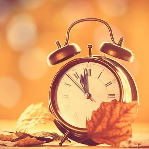 clock with autumn leaves