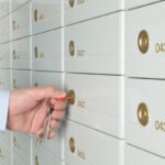 man opening po box with key