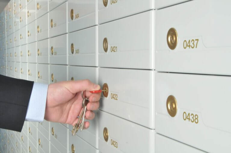 man opening po box with key