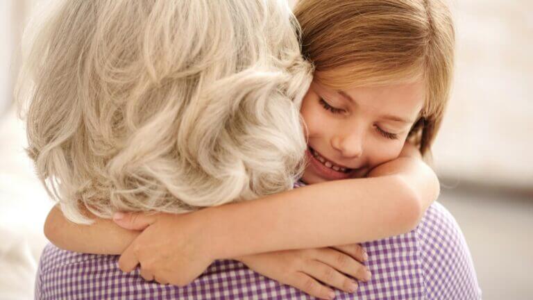 grandmother and granddaughter hugging