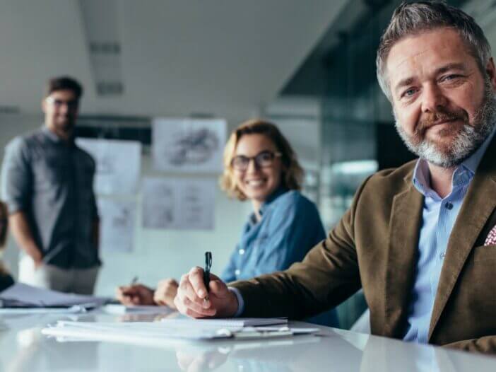 business meeting with smiling employees