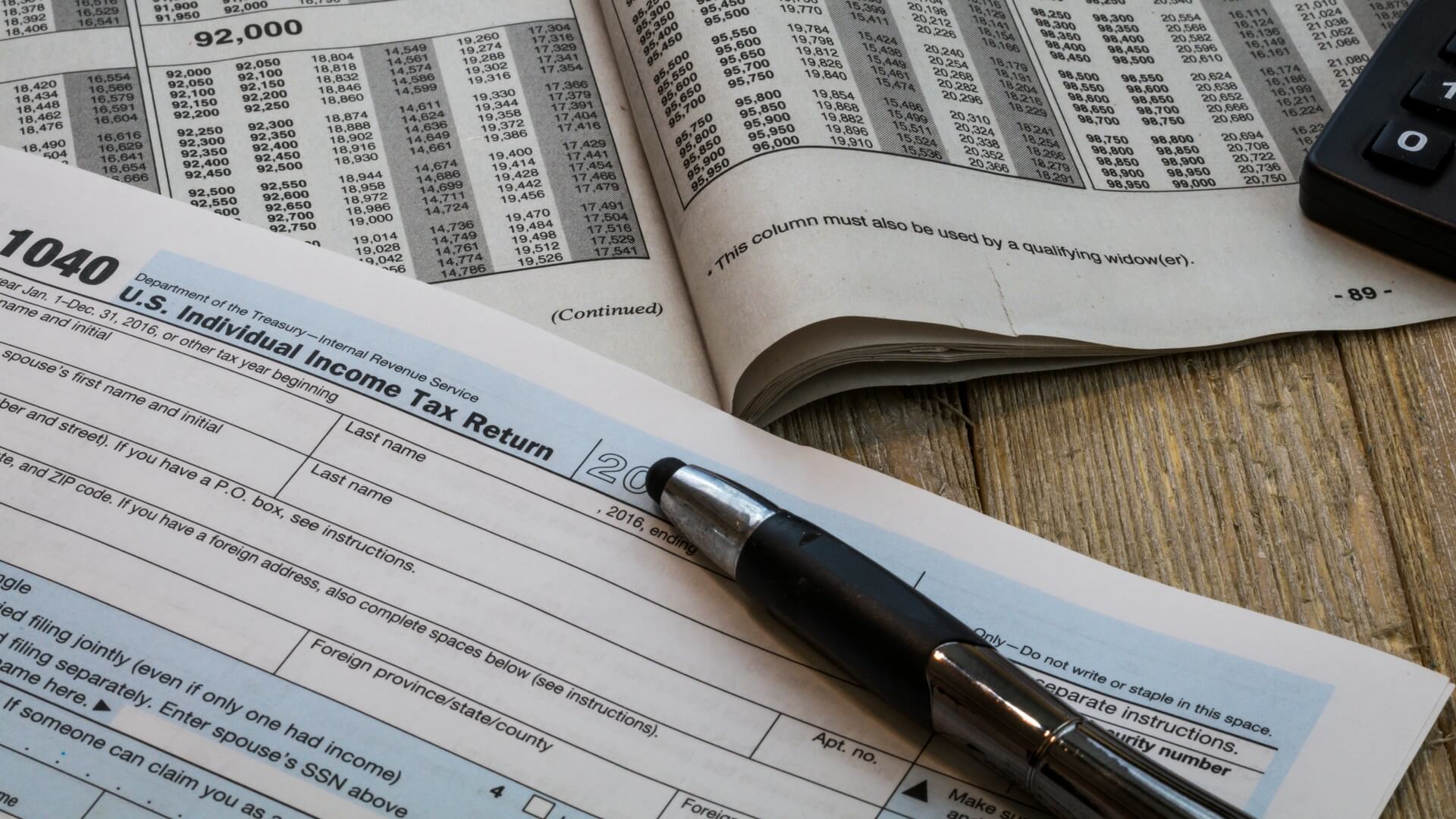tax return form with pen