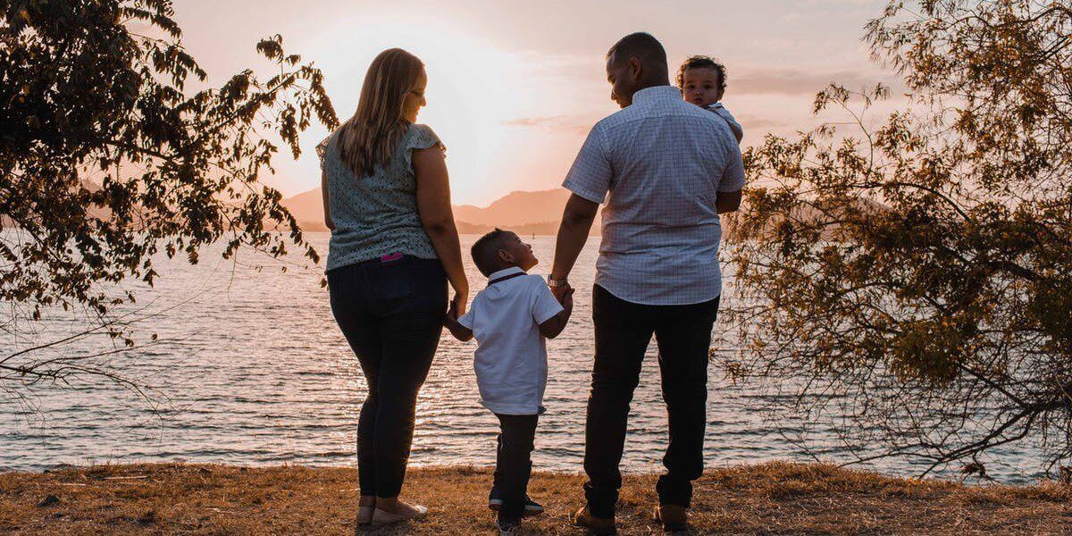 Family at edge of water