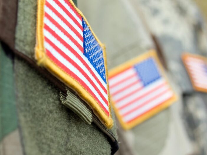 close-up of US flag on veterans uniform