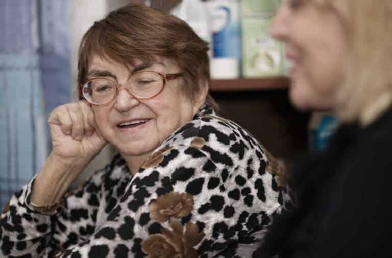 Senior lady chatting to a younger woman