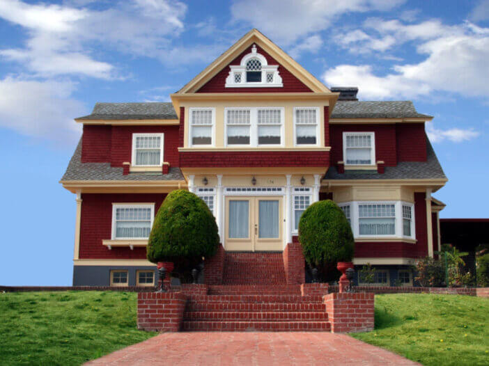 beautiful red house on blue sky