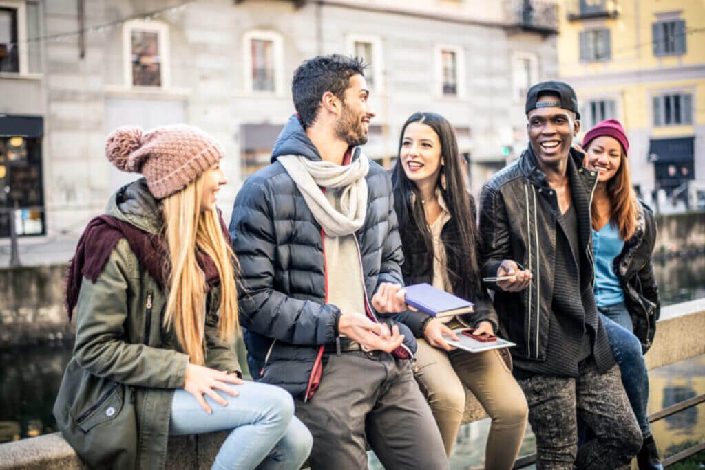 Young adult friends bonding outdoors