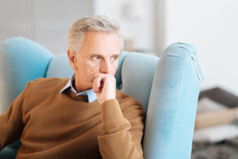 Pensive retired man recalling his memories