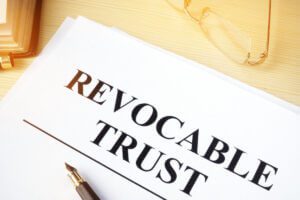 Revocable trust on a wooden desk.