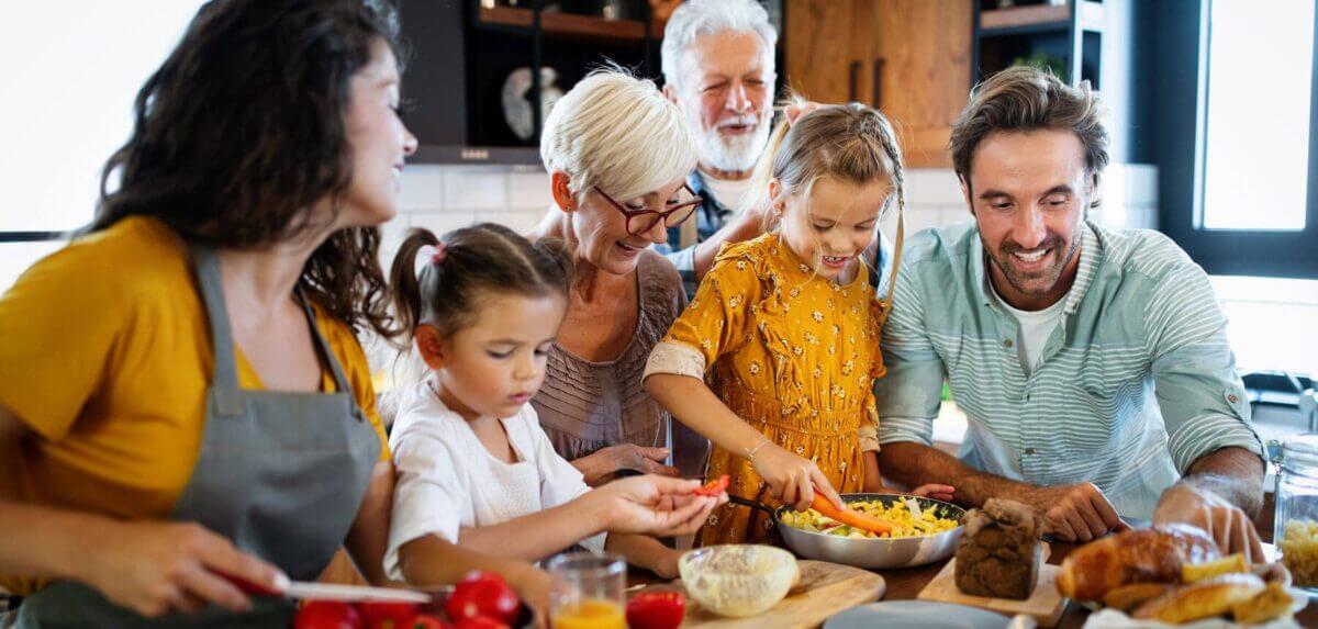 Multigenerational family makes a meal together