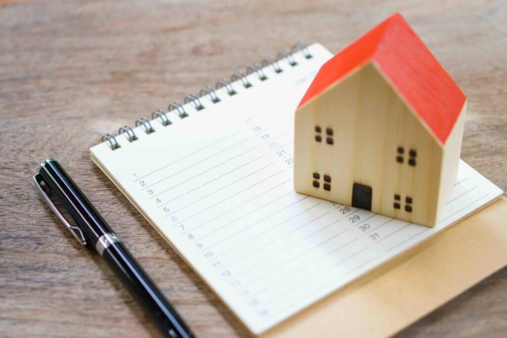 House Models and Book list. Check the quality in the home. Concept of buying a new home .Home inspection for maintenance Repair and Construction with copy space for your text or design.