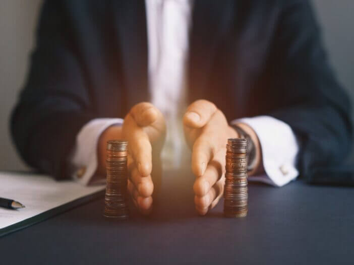 Attorney separates stacks of coins equally