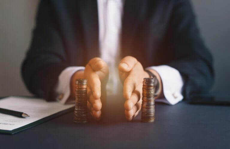 Attorney separates stacks of coins equally