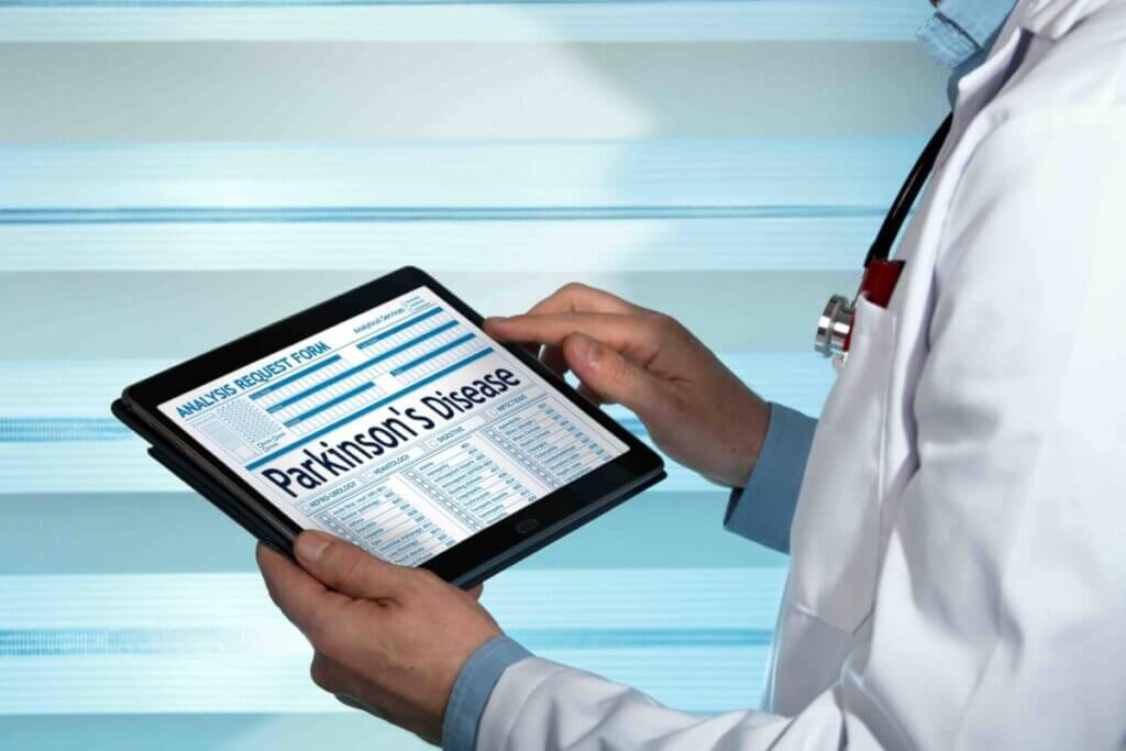 neurologist reading Parkinson’s Disease diagnosis in digital medical report