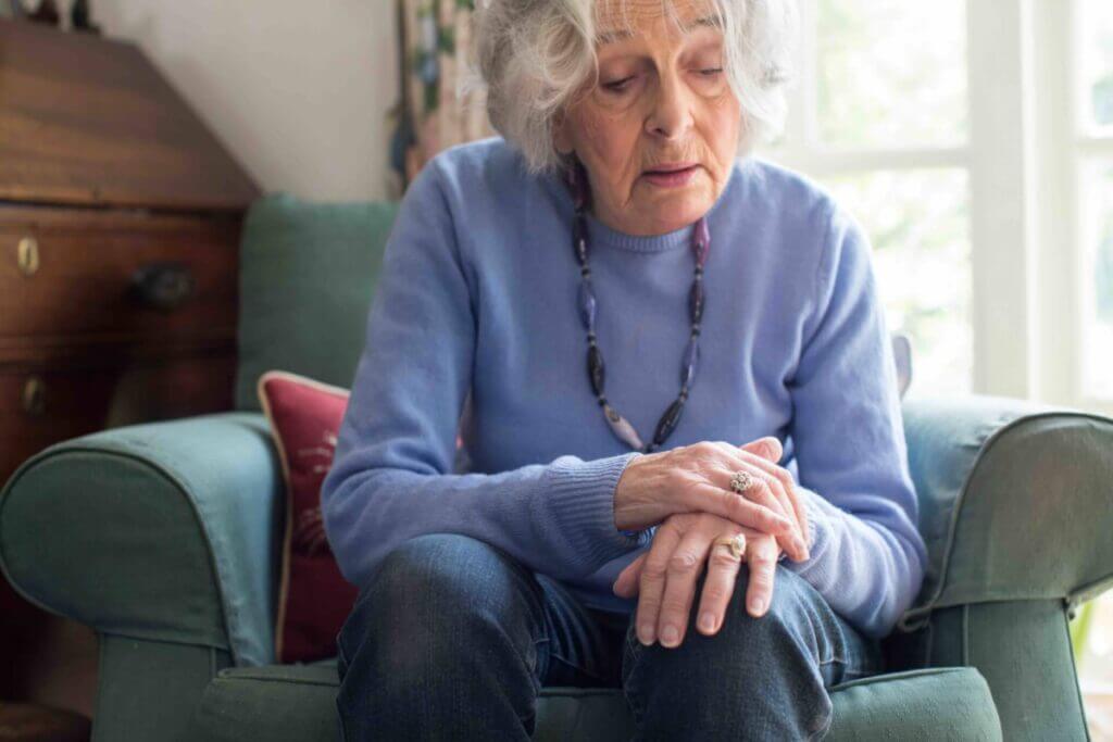 Senior Woman Suffering With Parkinson’s Disease