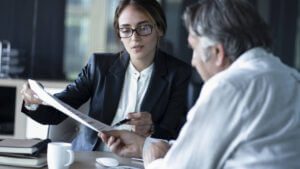 attorney point to document with elder client