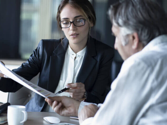 attorney point to document with elder client