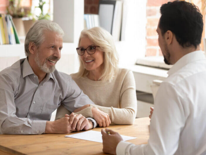 Elderly spouses during meeting with attorney