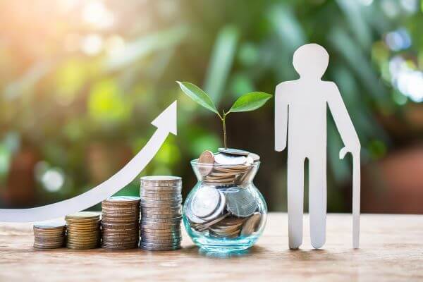 Paper cut of person with cane and up swooshing arrow over stacks of coins and a small glass jar filled with coins with small branch and leaves growing from it