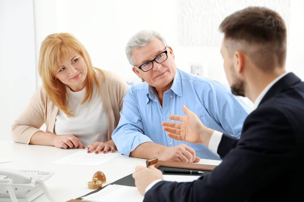 older couple meeting with attorney