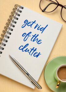 notebook with getting rid of clutter written on it