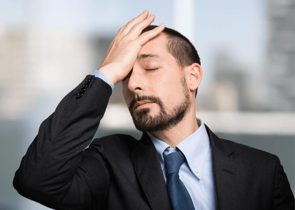 guy with palm of hand on forehead