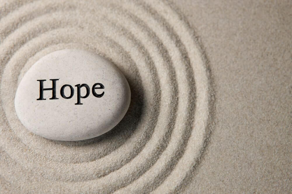 stone with the word hope on it