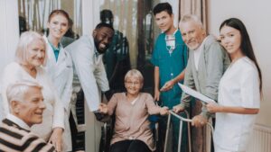 group of caregivers with women in a wheel chair