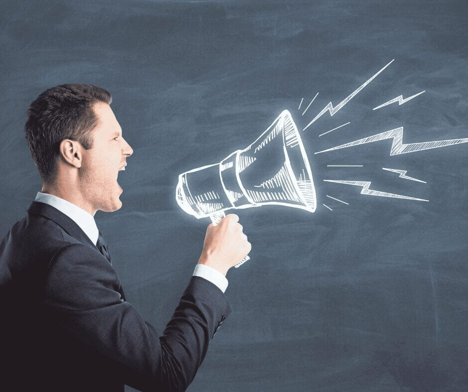 man shouting with a bull horn