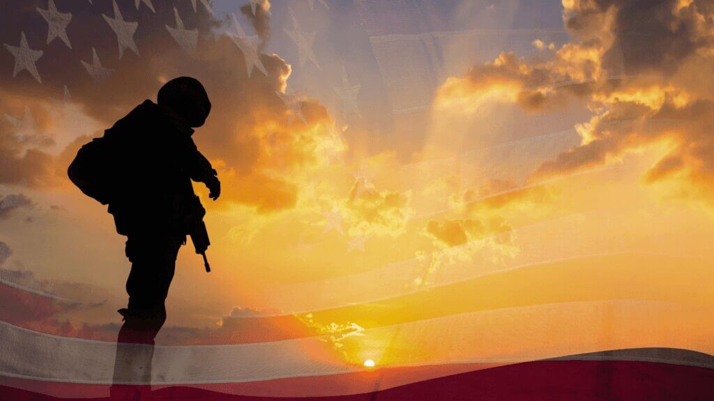 military man with sunset and American flag