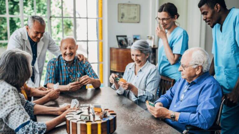 seniors playing cards at the table