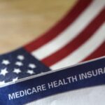 US flag with medicare insurance paperwork