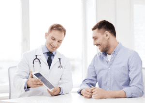 male patient talking to male healthcare provider