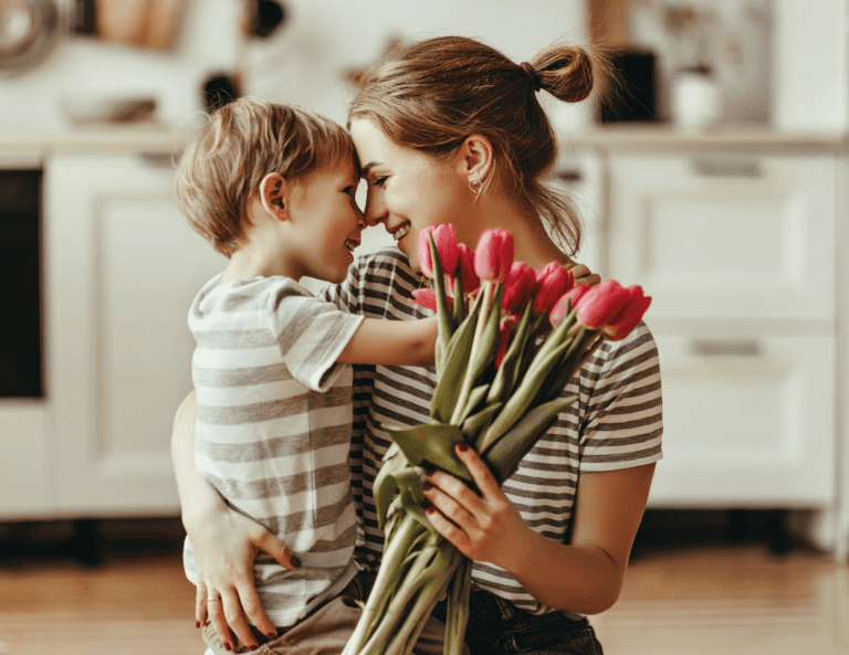 mom and child with flowers hugging