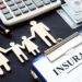 picture of life insurance clip board with family holding hands