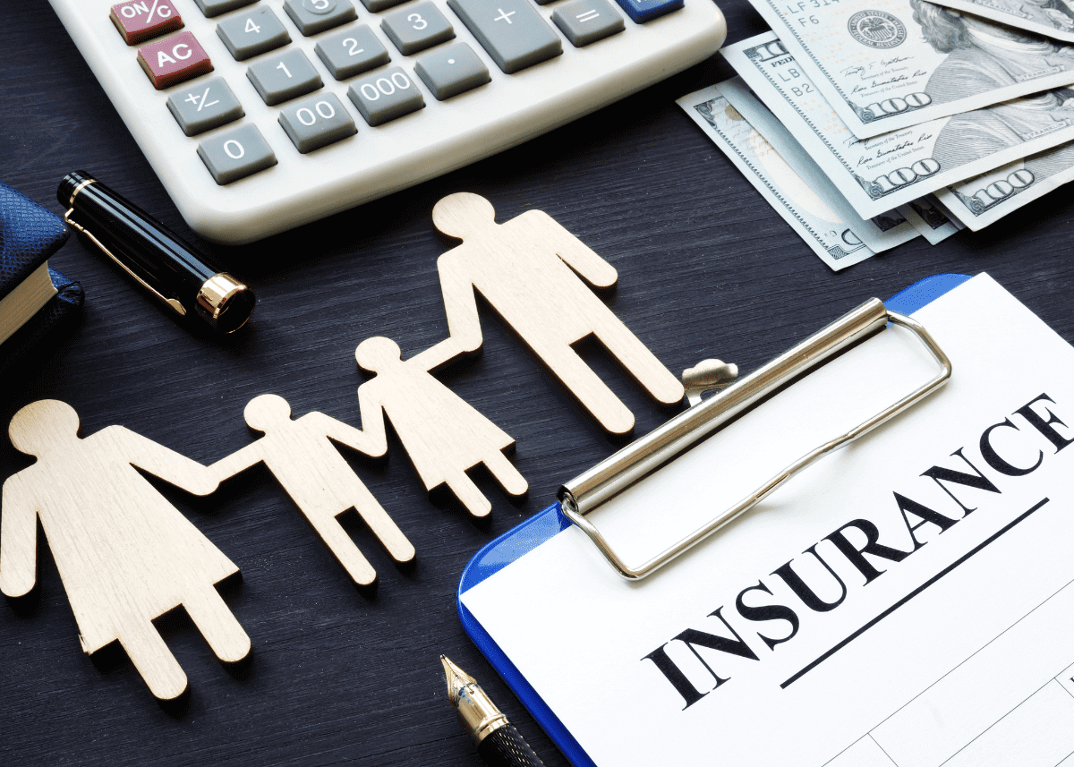 picture of life insurance clip board with family holding hands