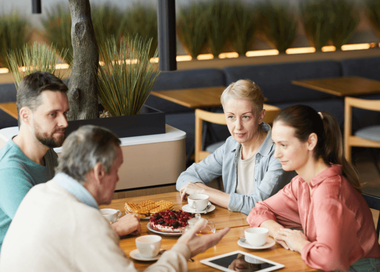 parents talking with their adult children over a meal