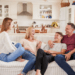 family with 18-year-old children sitting on couch