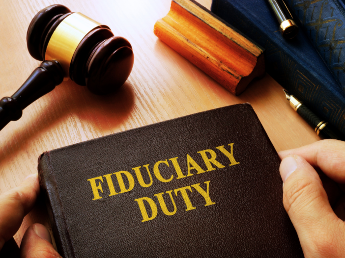 Gavel with a person holding a book about fiduciary duties.