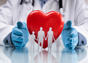 A Medicaid healthcare worker holding a heart with a family in between