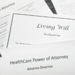 documents on a table titles advanced healthcare directive and power of attorney