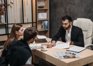 a lawyer talking with his clients about their estate and some tips