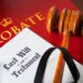 a folder titled probate with a last will and testament on top of it along with a gavel.