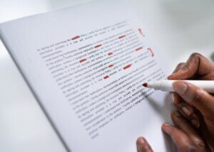 someone making corrections to a document