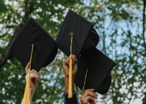 a picture of graduation caps in the air