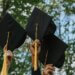 a picture of graduation caps in the air