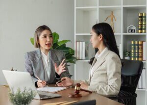 a lawyer talking to her client doing their mid year review