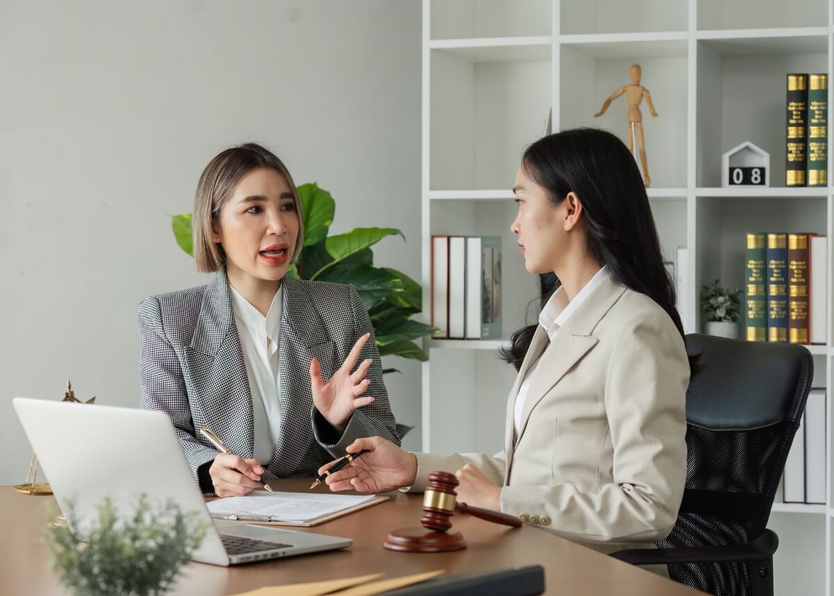 a lawyer talking to her client doing their mid year review