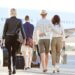 a couple boarding a flight on their way to their vacation