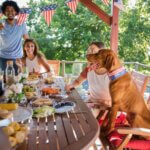 a family sitting around the table for the fourth of july eating food
